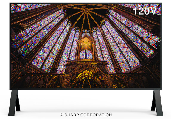 A floor standing large format display shows a stained-glass window image